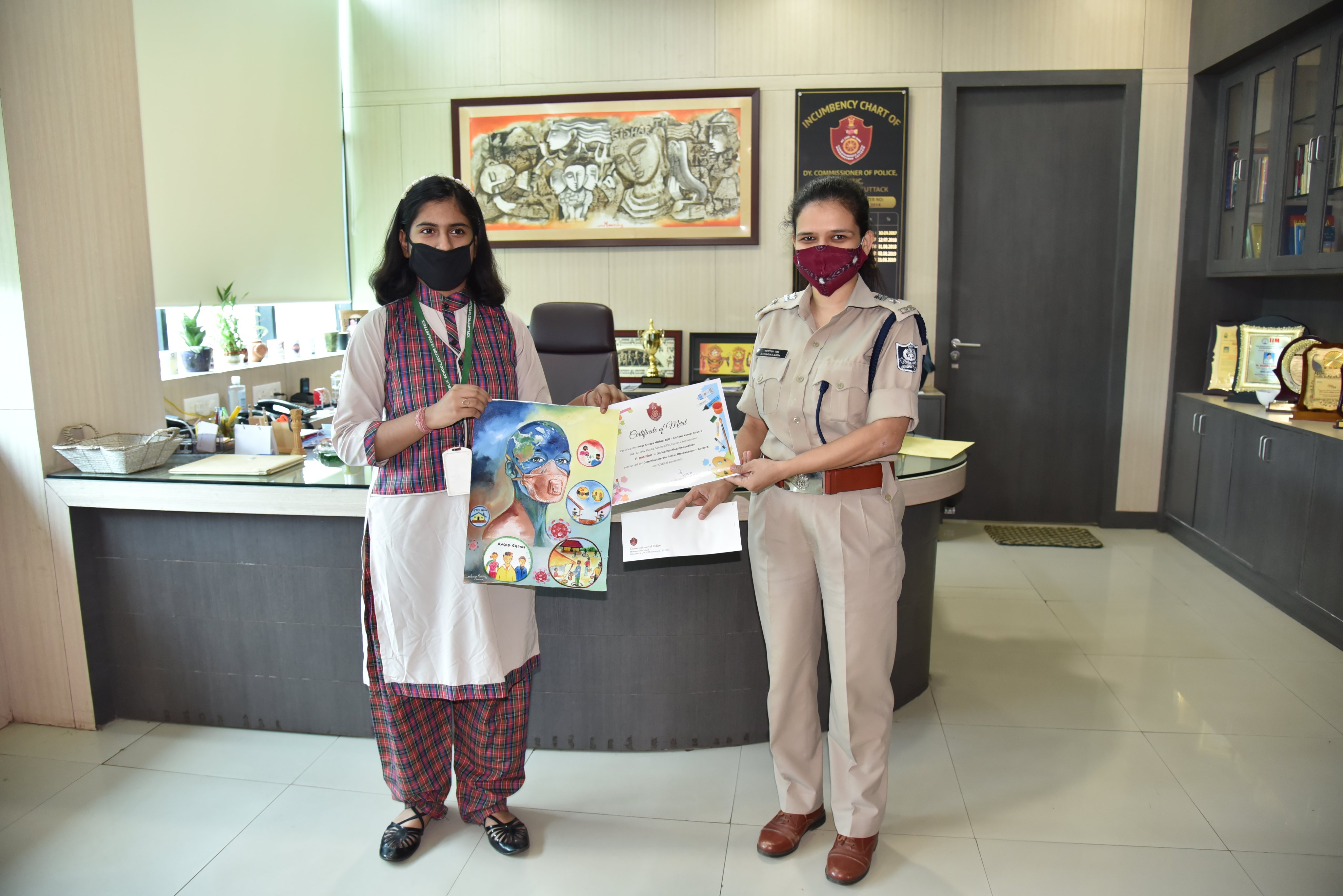 Awardees with  Two  Tiny Talents   under Spl. Mention category of our Online Art Competition on COVID19 pandemic being felicitated by  DCP Traffic Ms.Sagarika Nath at Police Seva Bhavan . 14.07.2020.